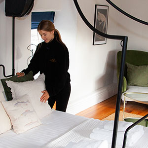 maid making bed